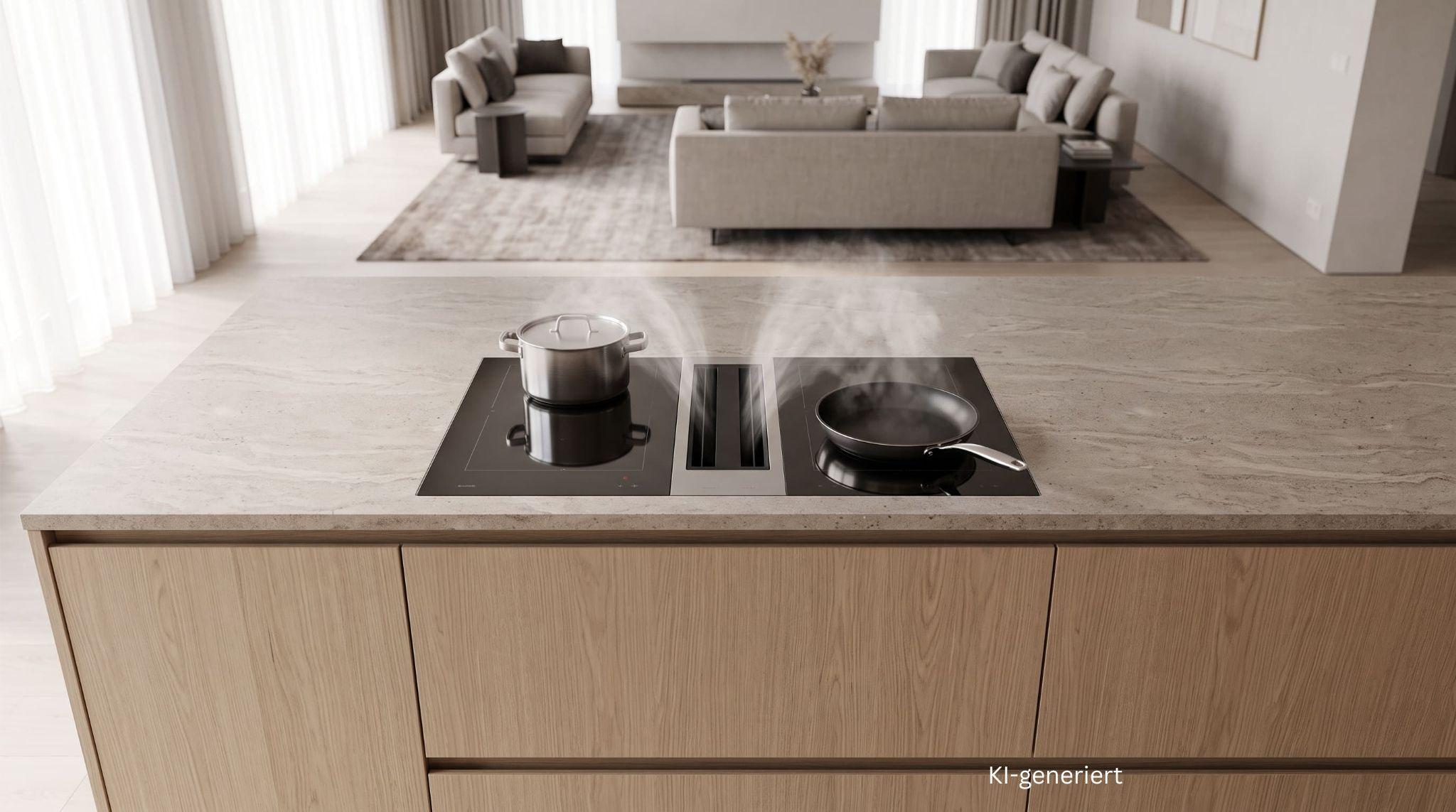 Kochfeld mit integriertem Dunstabzug in einer offenen Kücheninsel, Ansicht von oben.